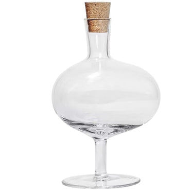 Kindred & Kin kosta Boda Bod Bottle in clear handmade crystal with a rounded bowl shape, slender foot, and removable cork stopper.