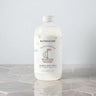 Kindred & Kin Bathorium Little Charlie Bubble Bath Milk in a baby bath setting