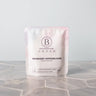 Bathorium Midnight Superbloom Crush bath soak pouch with floral design on a marble surface.