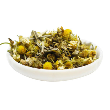 Kindred & Kin Brooklyn Tea Relax. Relate. Release herbal tea blend featuring dried chamomile flowers and lemongrass in a bowl.