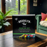 Kindred & Kin Brooklyn Tea Cream Earl Grey black tea box with 12 biodegradable sachets on a wooden table.