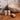 Kindred & Kin Hajjar Blanc Hand + Body Wash bottles and bar soap on wooden counter next to stone sink.