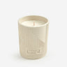 Kindred & Kin Hajjar Blanc Scented Candle in a textured ceramic vessel with geometric patterns. Creamy coconut and apricot fragrance.