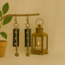 Kindred & Kin Kora Drop Earrings: black carved horn pendants with aged brass accents and disks. Handcrafted in Senegal.