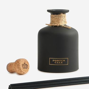 Kindred & Kin matte black glass diffuser with gold label and jute rope accent, includes cork stopper and reeds.