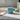 Kindred & Kin Benamôr Gordíssimo nutritive soap bar in light blue with a square embossed logo on a marble surface.