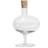 Kindred & Kin kosta Boda Bod Bottle in clear handmade crystal with a rounded bowl shape, slender foot, and removable cork stopper.