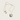 Kindred & Kin/Belart  Full-Moon Larkspur necklace featuring preserved purple and white flowers in resin on a gold-plated chain.