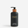 Kindred & Kin Ruby Red Hand + Body Wash in a matte black bottle with a wooden pump dispenser. 300ml.