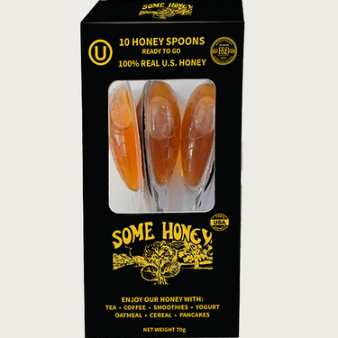 Kindred & Kin Some Honey 10 pack of single-serve raw clover honey spoons in a black display box